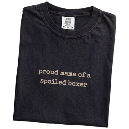 Folded Black Comfort Colors® T-shirt showing Proud Mama of a Spoiled Boxer lettering