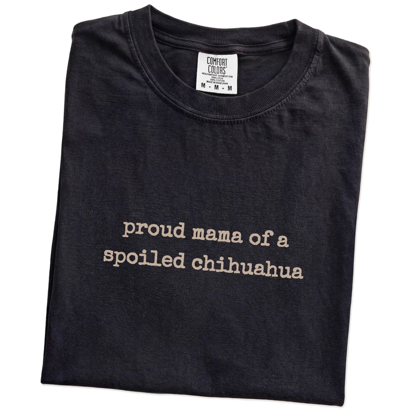 Folded Black Comfort Colors® T-shirt showing Proud Mama of a Spoiled Chihuahua lettering