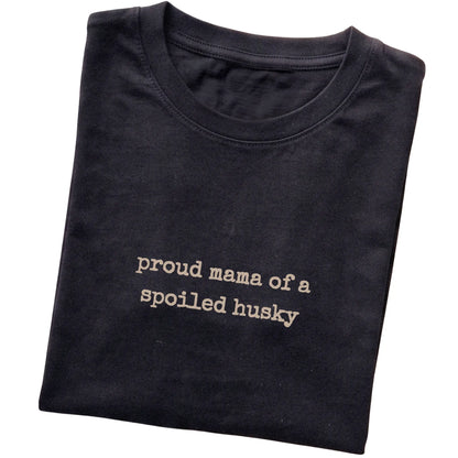 Black Proud Mama of a Spoiled Husky T-shirt folded to show the printed design