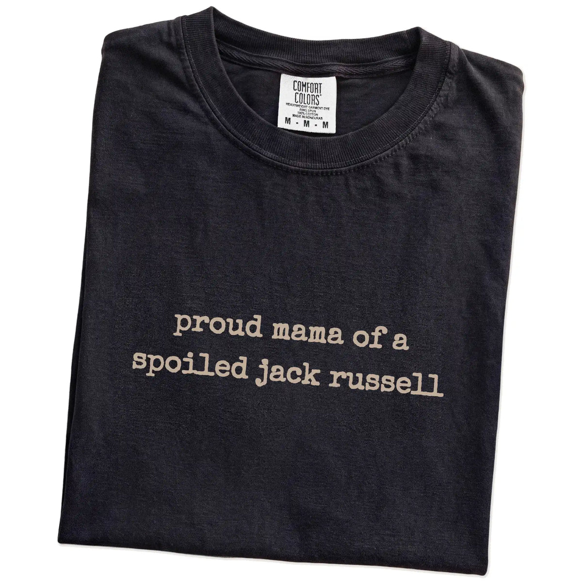 Folded Black Comfort Colors® T-shirt showing Proud Mama of a Spoiled Jack Russell lettering