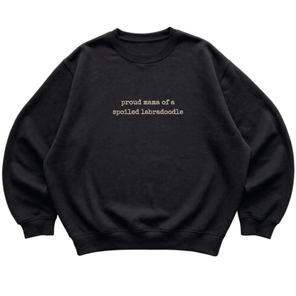 Black Proud Mama of a Spoiled Labradoodle sweatshirt laid flat