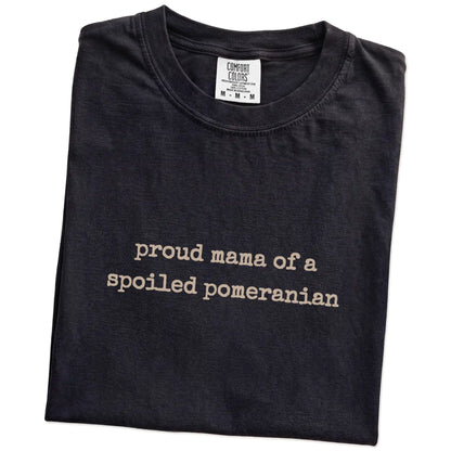 Folded Black Comfort Colors® T-shirt showing Proud Mama of a Spoiled Pomeranian lettering