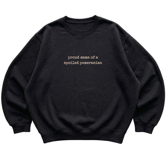 Black Proud Mama of a Spoiled Pomeranian sweatshirt laid flat