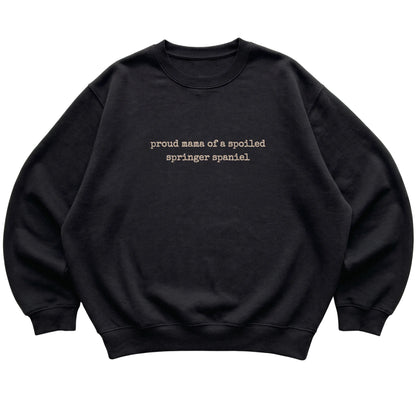 Black Proud Mama of a Spoiled Springer Spaniel sweatshirt laid flat