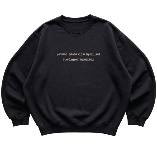 Black Proud Mama of a Spoiled Springer Spaniel sweatshirt laid flat