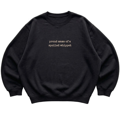 Black Proud Mama of a Spoiled Whippet sweatshirt laid flat