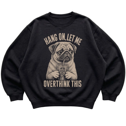 Black crewneck sweatshirt featuring Overthinking Pug, laid-flat presentation
