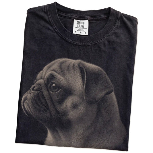 Folded Black Comfort Colors® T-shirt showing a detailed photographic portrait of a Pug