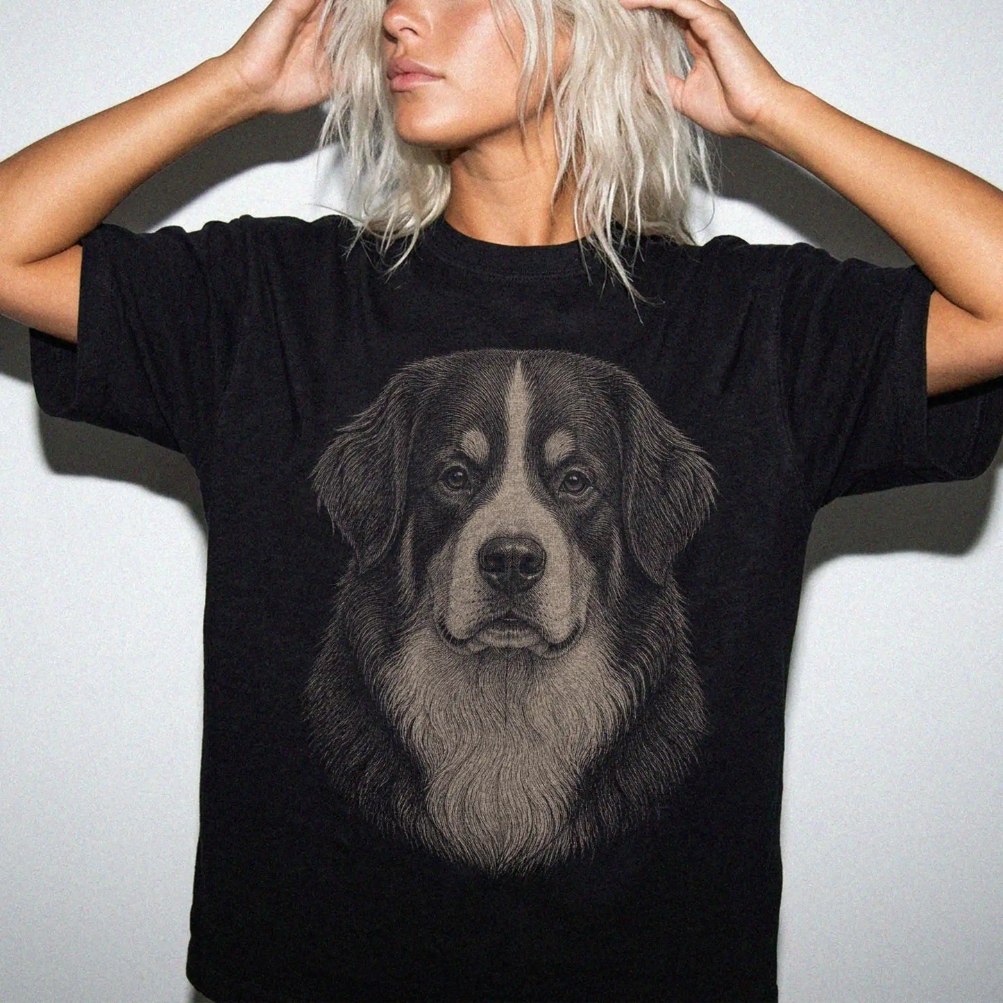 Model wearing a Black Comfort Colors® T-shirt with a realistic drawing of a Bernese Mountain Dog