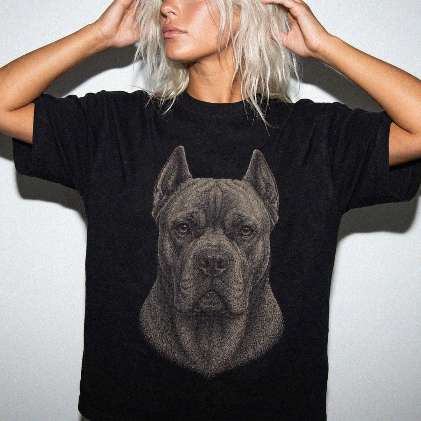 Model wearing a Black Comfort Colors® T-shirt with a realistic drawing of a Cane Corso