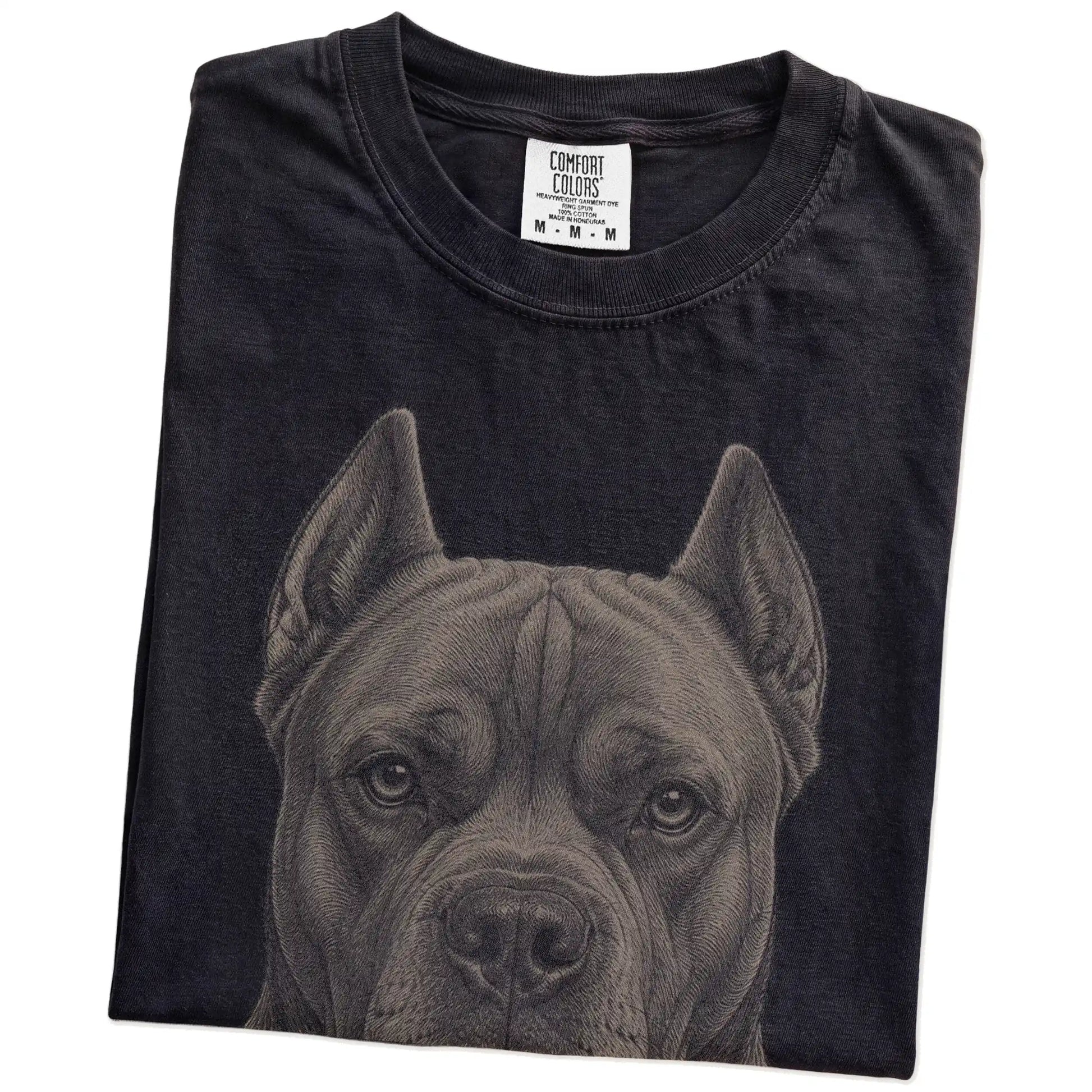 Folded Black Comfort Colors® T-shirt showing a realistic drawing of a Cane Corso