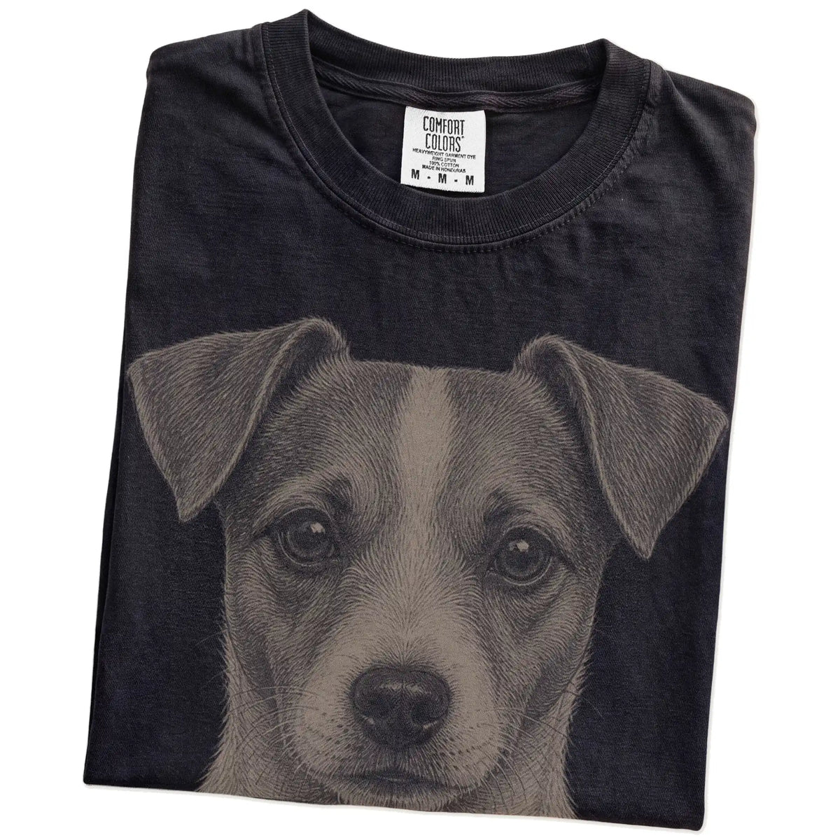 Folded Black Comfort Colors® T-shirt showing a realistic drawing of a Jack Russell