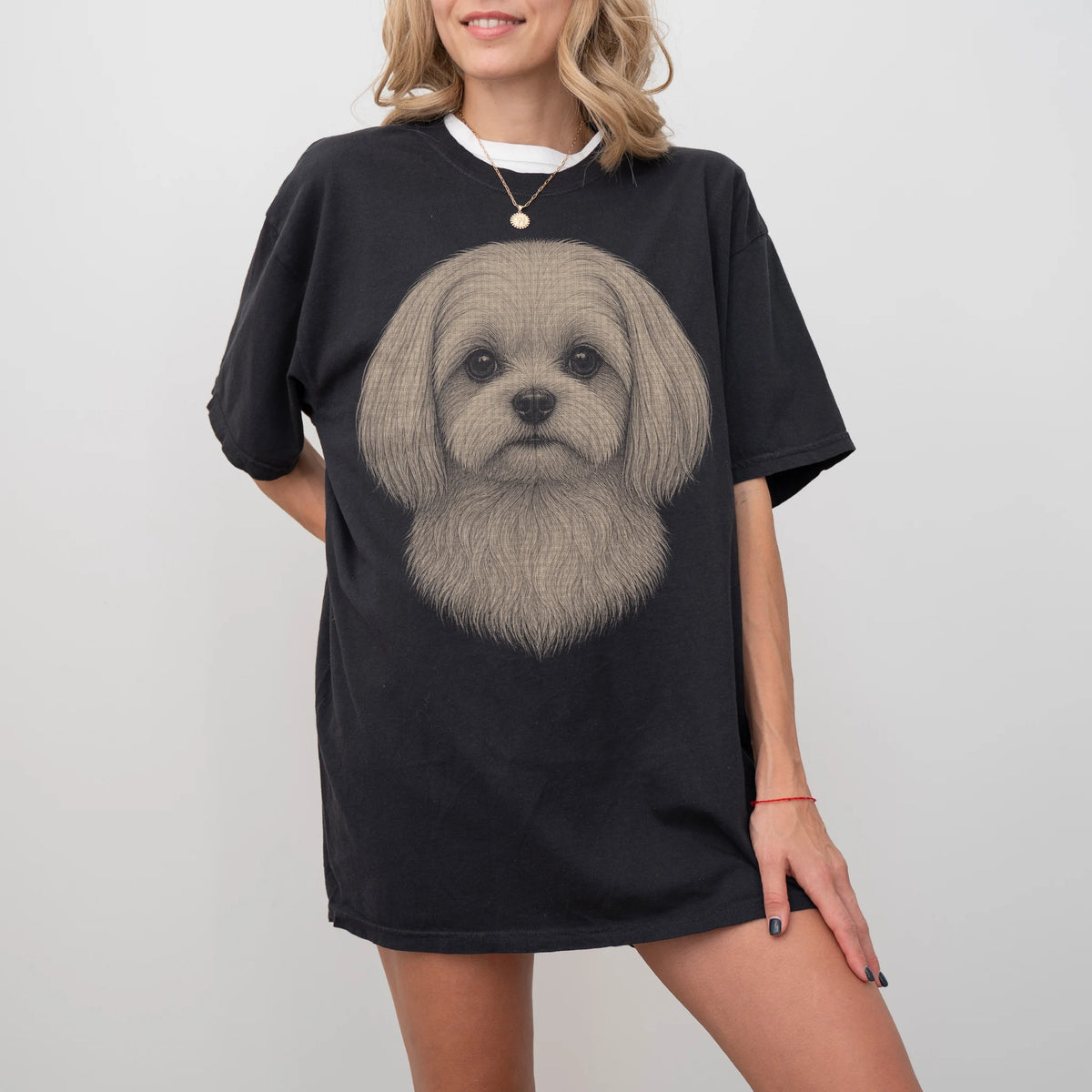 Model wearing a Black Comfort Colors® T-shirt with a realistic drawing of a Maltese