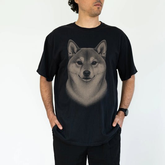 Model wearing a Black Comfort Colors® T-shirt with a realistic drawing of a Shiba Inu