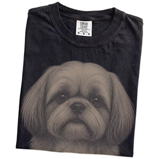 Folded Black Comfort Colors® T-shirt showing a realistic drawing of a Shih Tzu