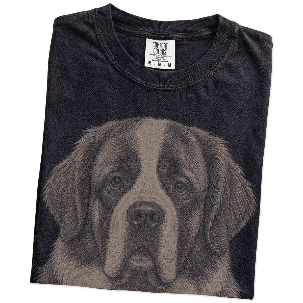 Folded Black Comfort Colors® T-shirt showing a realistic drawing of a St Bernard