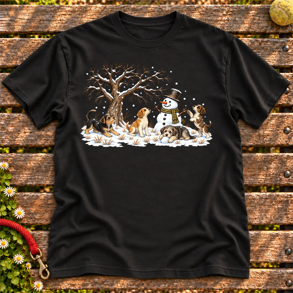 Four rescue puppies playing beside a snowman on Black T-shirt