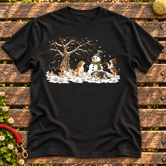 Four rescue puppies playing beside a snowman on Black T-shirt