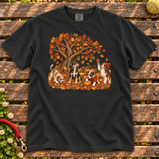 Four Rescue Mixed Breed puppies with pumpkins beneath an autumn tree on a Black Comfort Colors T-shirt