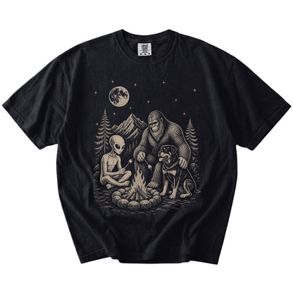 Rottweiler camping with Bigfoot and an alien on a Black Comfort Colors® T-shirt