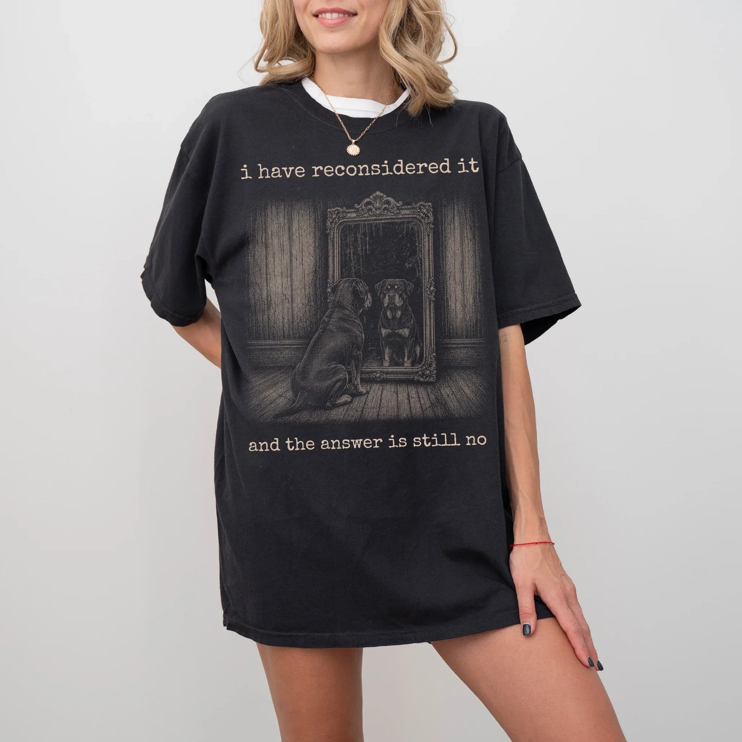 Model wearing a Black Comfort Colors® T-shirt with “the answer is still no” rottweiler design