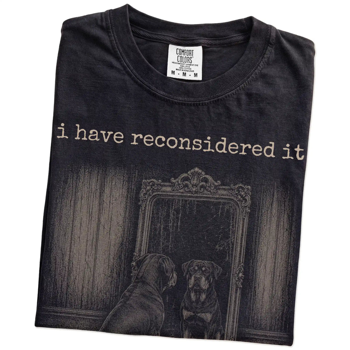 Folded Black Comfort Colors® T-shirt showing “the answer is still no” rottweiler design