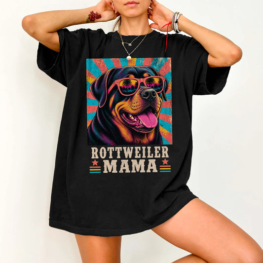 Retro Rottweiler Mama design on a Black Comfort Colors T-shirt worn by a model