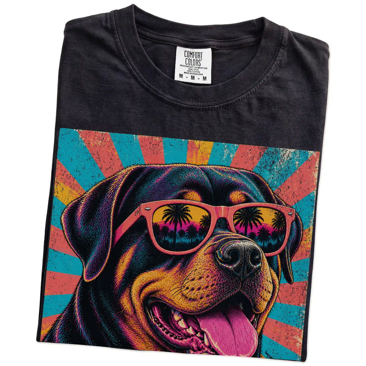 Retro Rottweiler Mama design on a Black Comfort Colors T-shirt folded detail