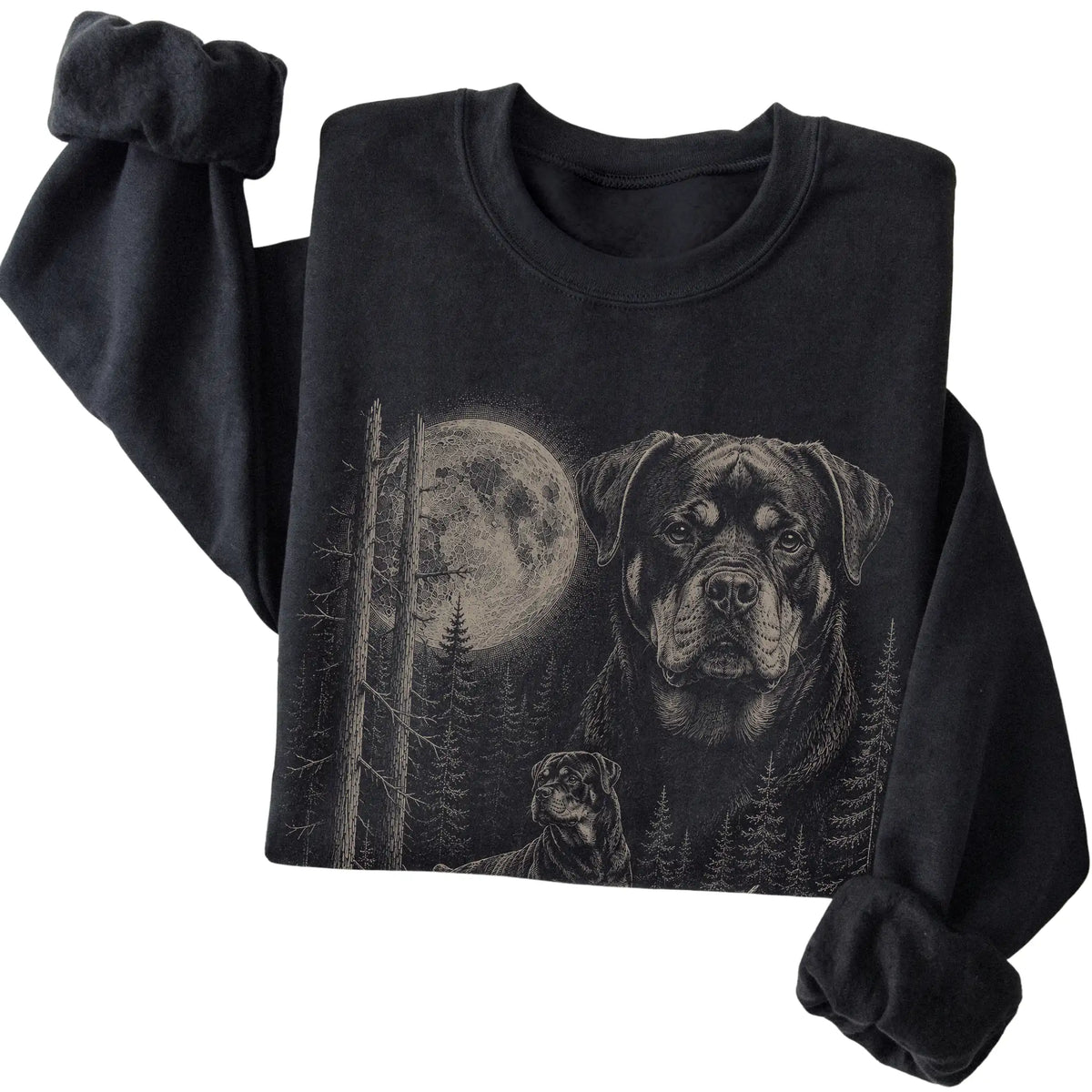 Folded black crewneck sweatshirt showing the Rottweiler Moonlit Forest graphic