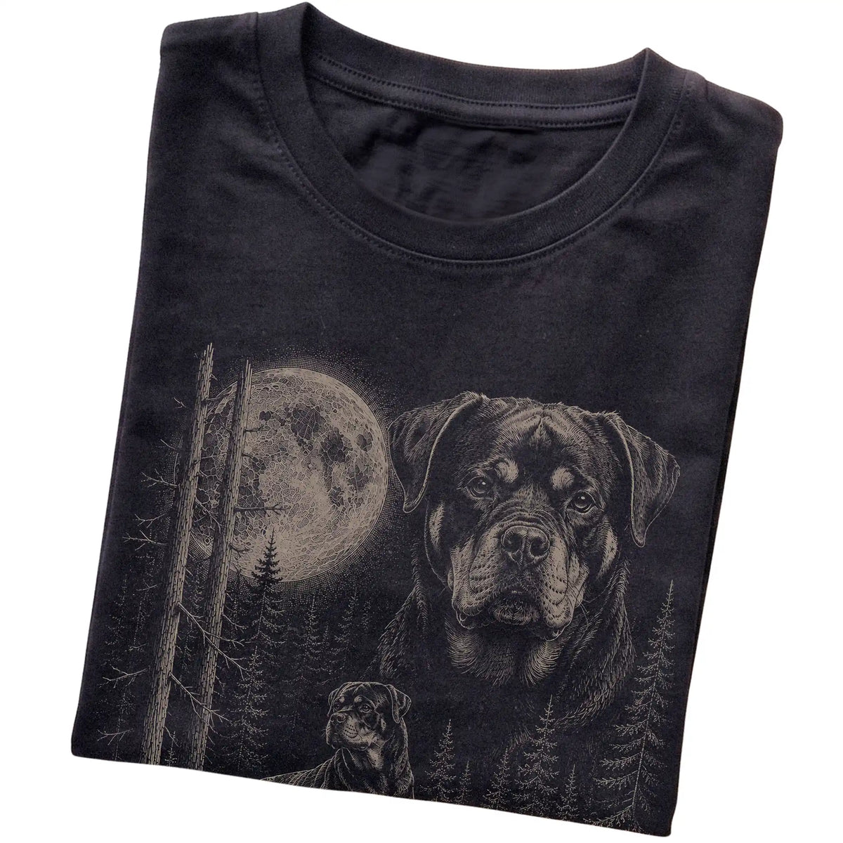 Folded black Softstyle T-shirt showing the Rottweiler Moonlit Forest graphic