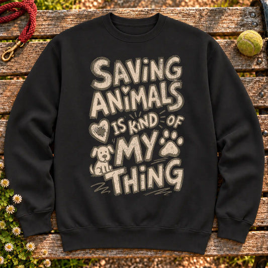 Saving Animals is kind of my thing on a Black crewneck sweatshirt, shown flat