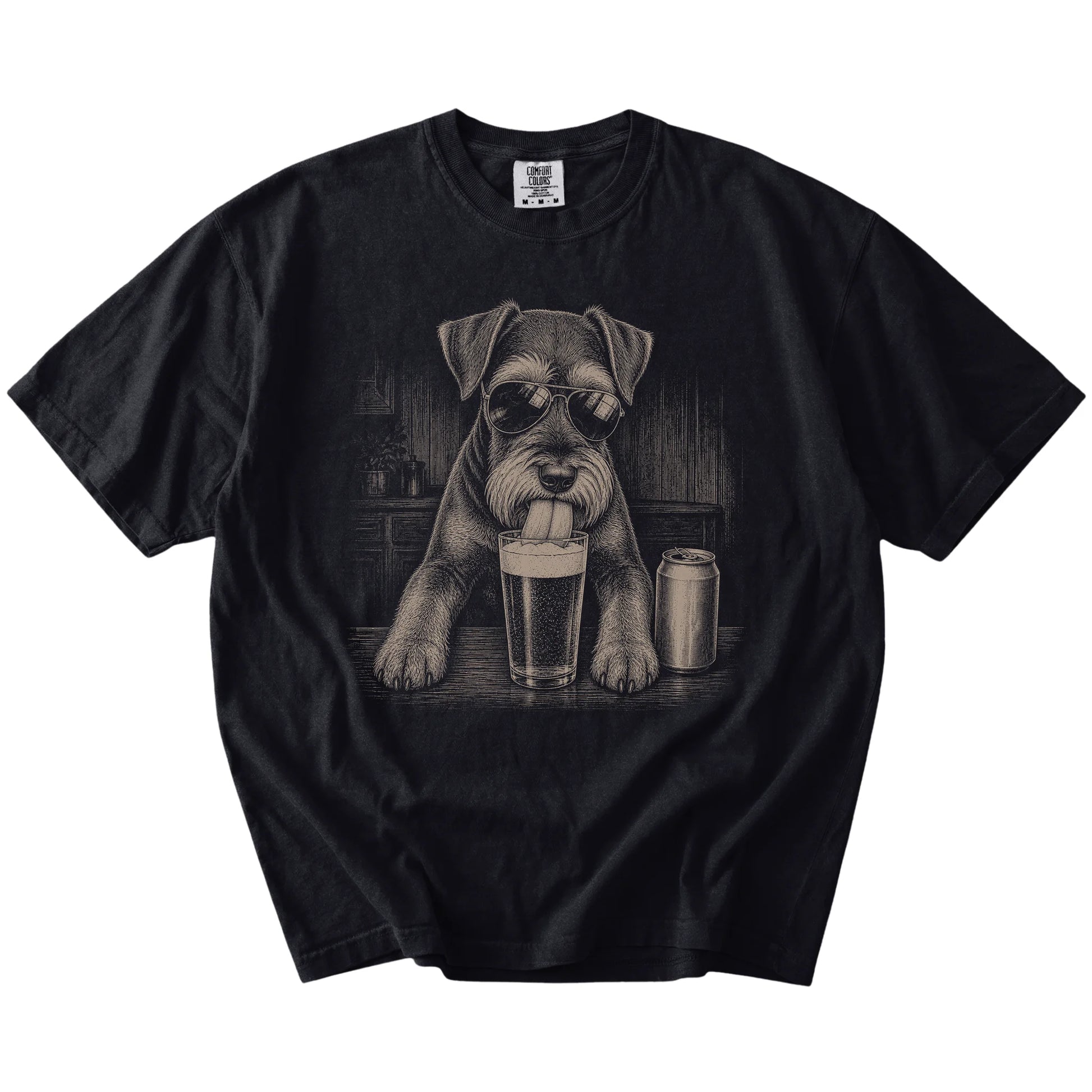 Schnauzer sneaking a drink from a foamy pint at home on a Black Comfort Colors® t-shirt