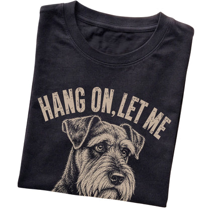 Black T-shirt featuring Overthinking Schnauzer, folded presentation