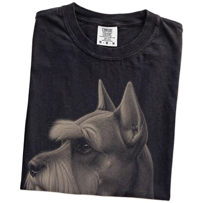 Folded Black Comfort Colors® T-shirt showing a detailed photographic portrait of a Schnauzer