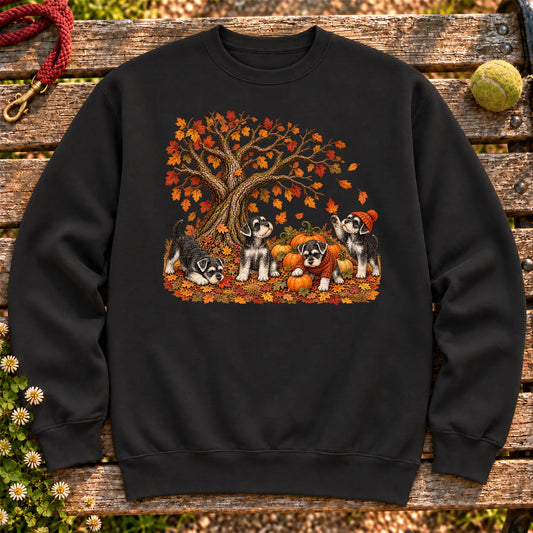 Schnauzer puppies in an autumn pumpkin patch on a Black crewneck sweatshirt