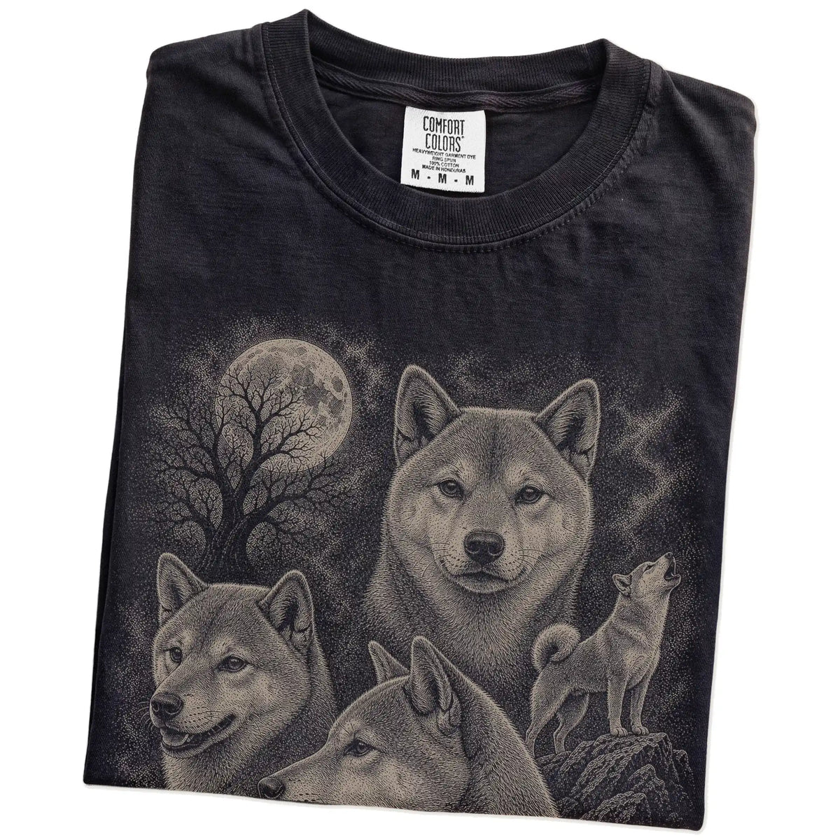 Folded Black Comfort Colors® T-shirt showing a vintage moon montage featuring Shiba Inu