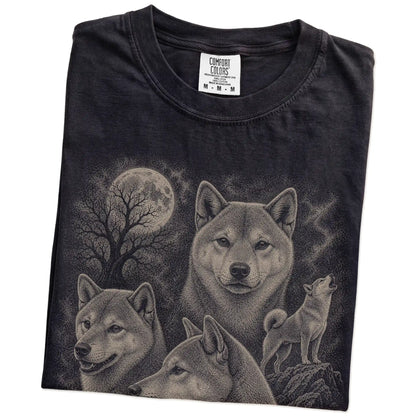 Folded Black Comfort Colors® T-shirt showing a vintage moon montage featuring Shiba Inu