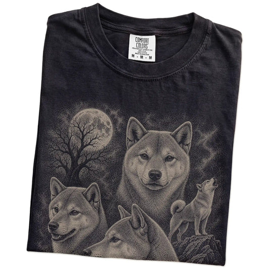 Folded Black Comfort Colors® T-shirt showing a vintage moon montage featuring Shiba Inu