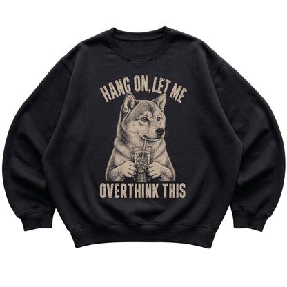 Black crewneck sweatshirt featuring Overthinking Shiba Inu, laid-flat presentation