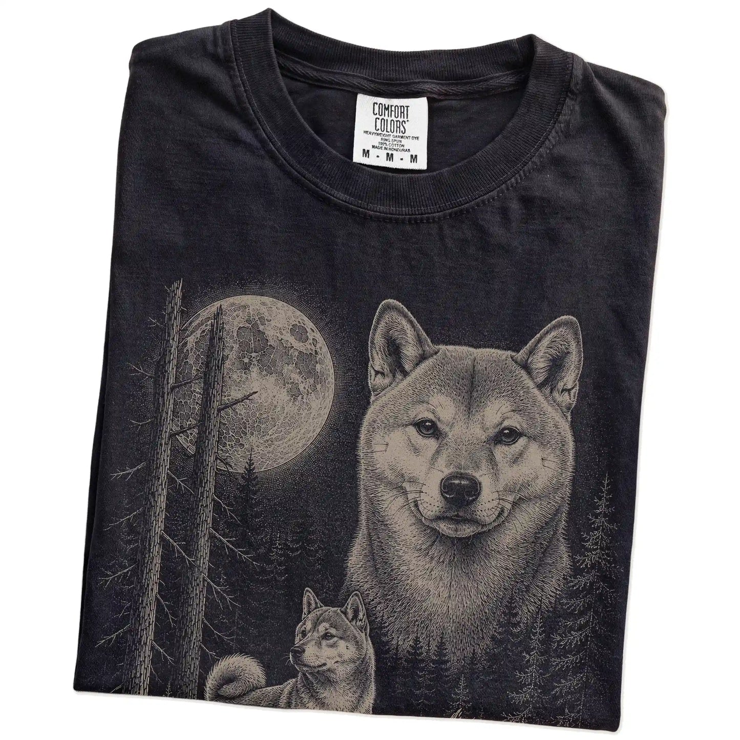 Folded Black Shiba Inu Moonlit Forest T-Shirt showing the graphic