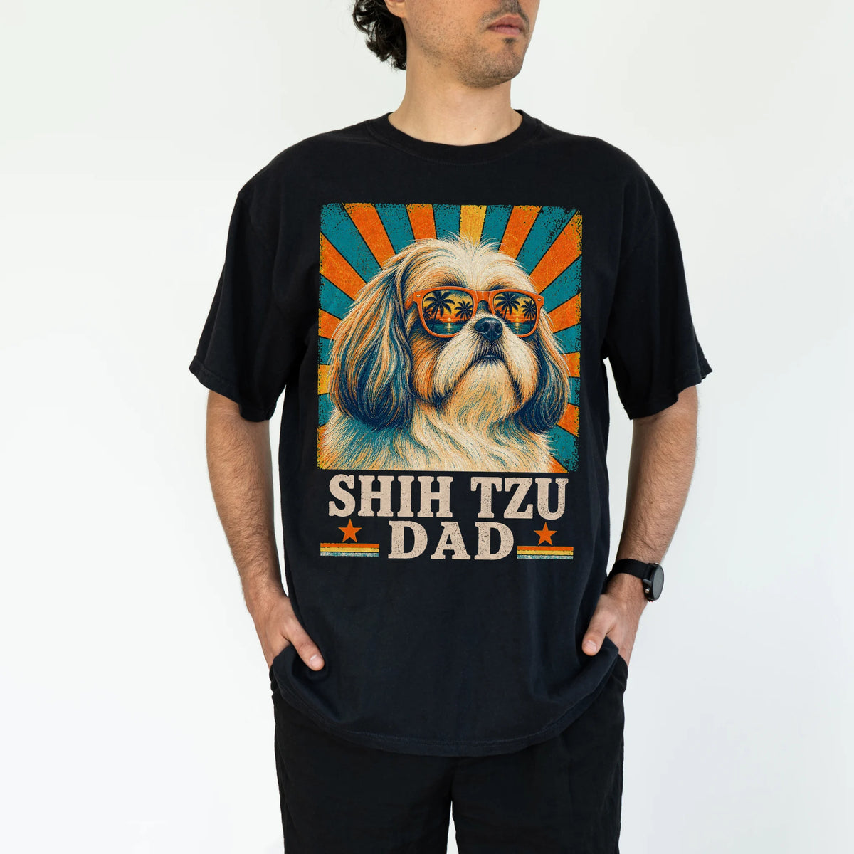 Retro Shih Tzu Dad design on a Black Comfort Colors T-shirt worn by a model