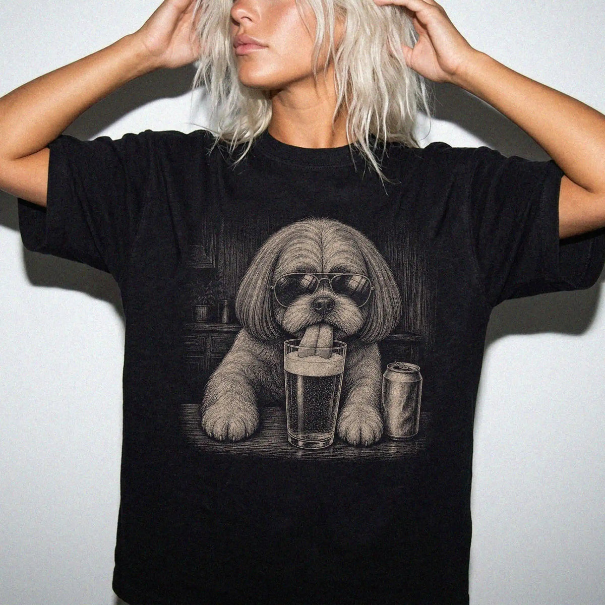Model wearing a Black Comfort Colors® t-shirt with Shih Tzu sneaking a drink from a pint