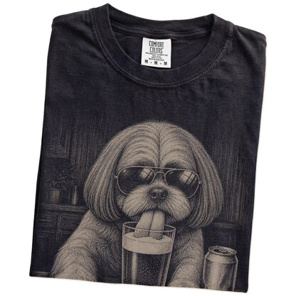 Folded Black Comfort Colors® t-shirt showing Shih Tzu sneaking a drink from a pint