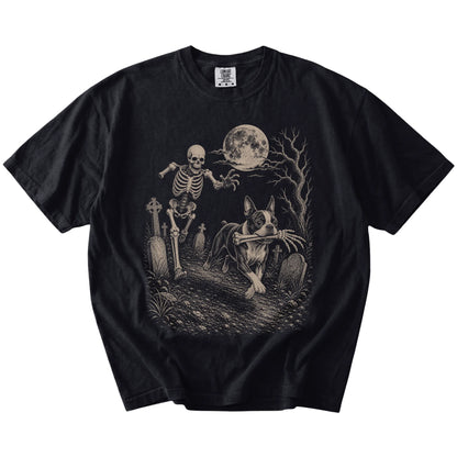 Boston Terrier running from a skeleton on a Black Comfort Colors® T-shirt