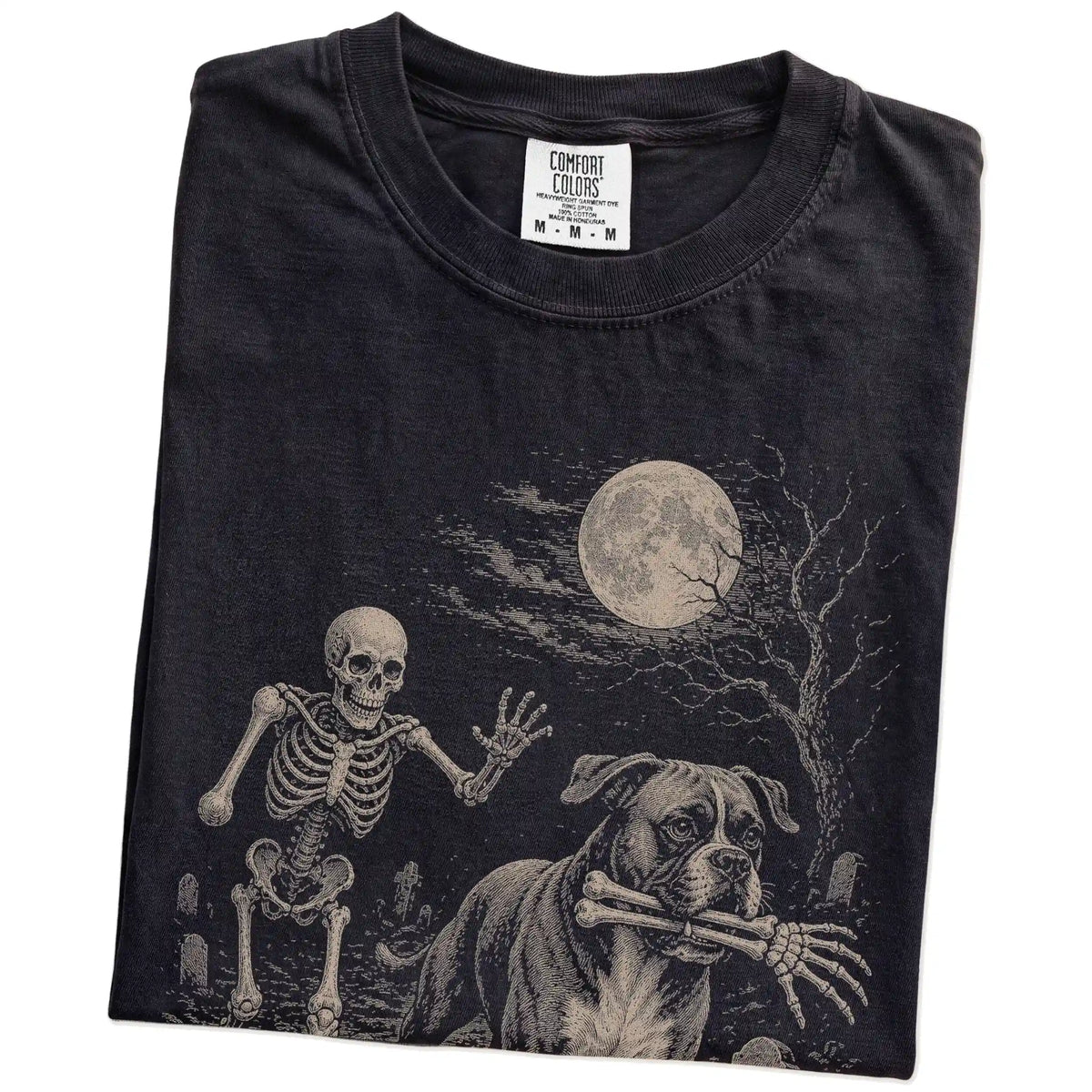 Folded black T-shirt with a Boxer carrying a skeleton arm through a graveyard.