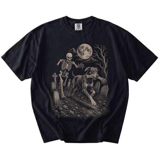 Doberman running from a skeleton on a Black Comfort Colors® T-shirt