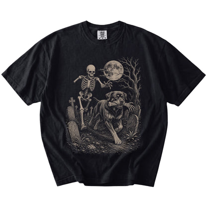 Rottweiler running from a skeleton on a Black Comfort Colors® T-shirt