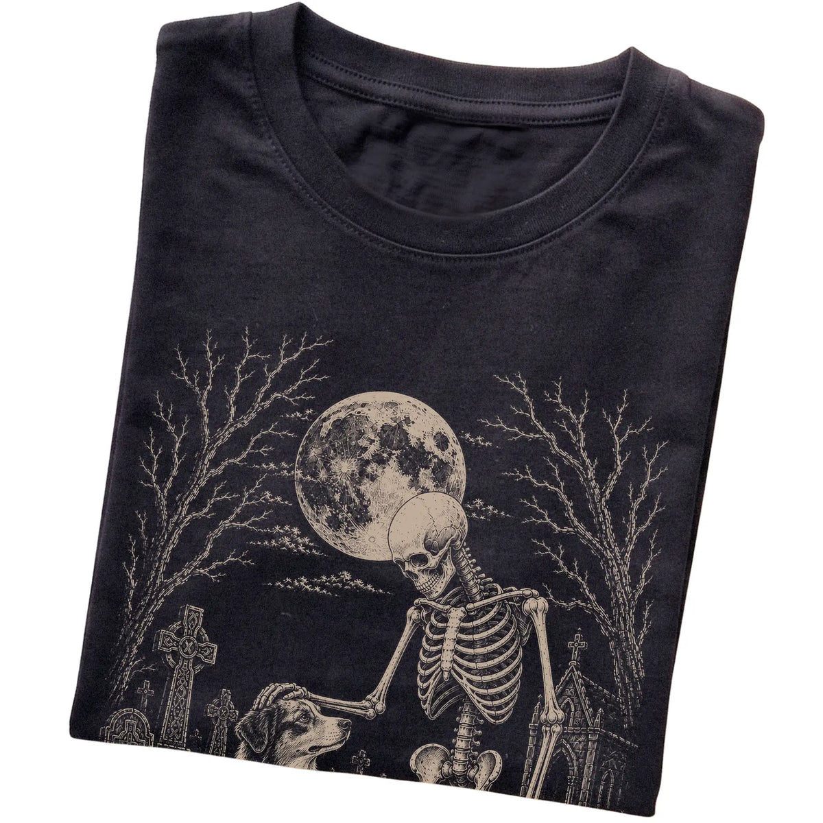 Folded Black T-shirt with a skeleton petting an Australian Shepherd in a graveyard