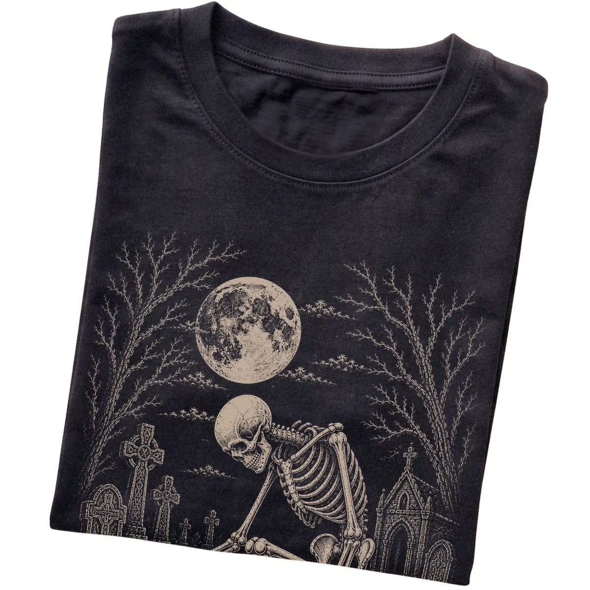 Folded Black T-shirt with a skeleton petting a Bichon Frise in a graveyard
