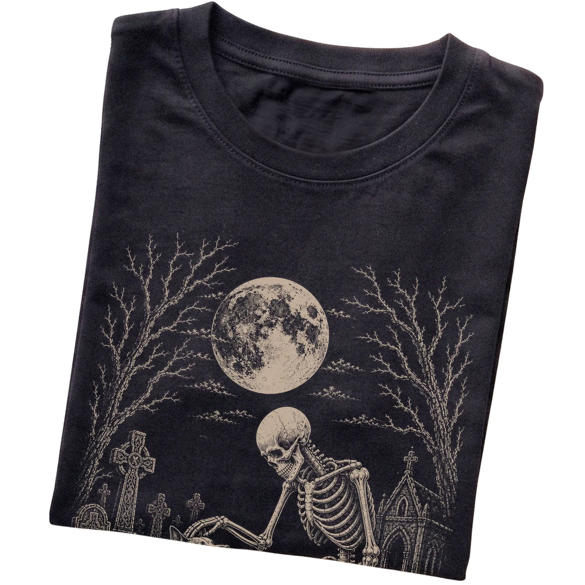 Folded Black T-shirt with a skeleton petting a Blue Heeler in a graveyard